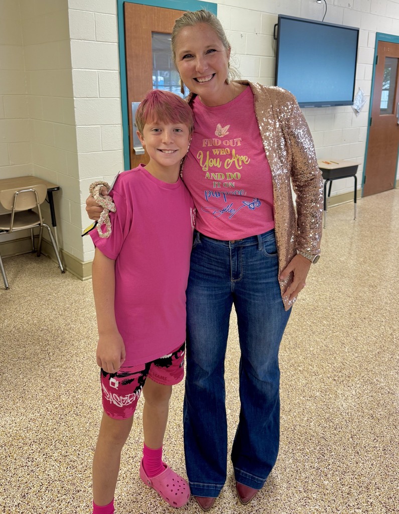staff and student dressed up for Dolly Day