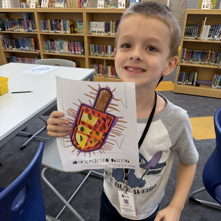 A student holding a Hispanic heritage month popsicle drawing