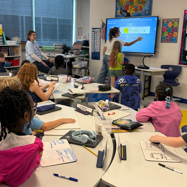 students doing guided math lessons with their teacher