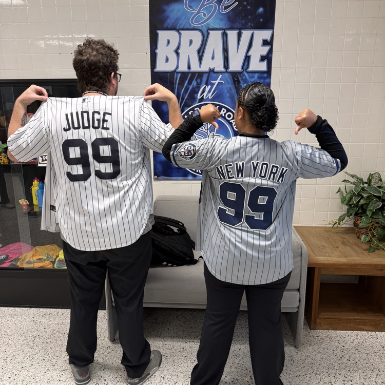 Back of two staff members with New York Yankees  Judge.