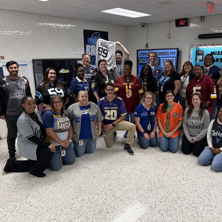 Staff members in their jerseys in the main lobby. 