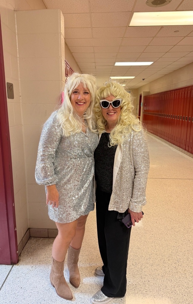 Mrs. Taylor and Mrs. Barrett dressed as Dolly Parton