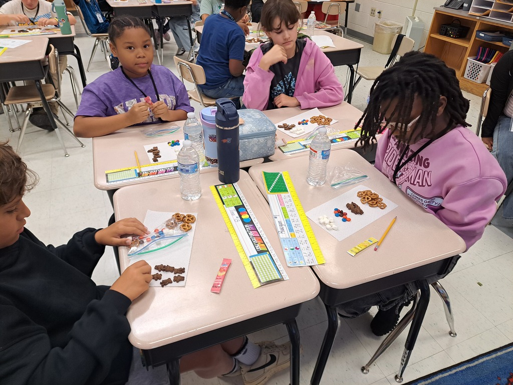 Students sorting materials using their physical properties.