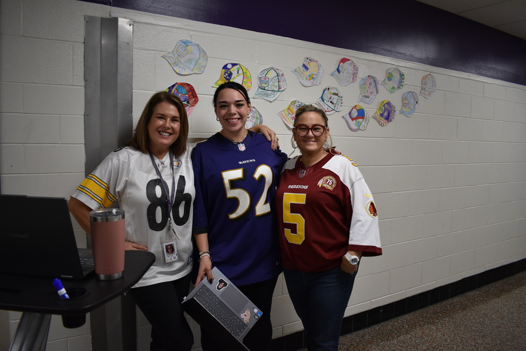 Teachers and students posing for jersey Day!