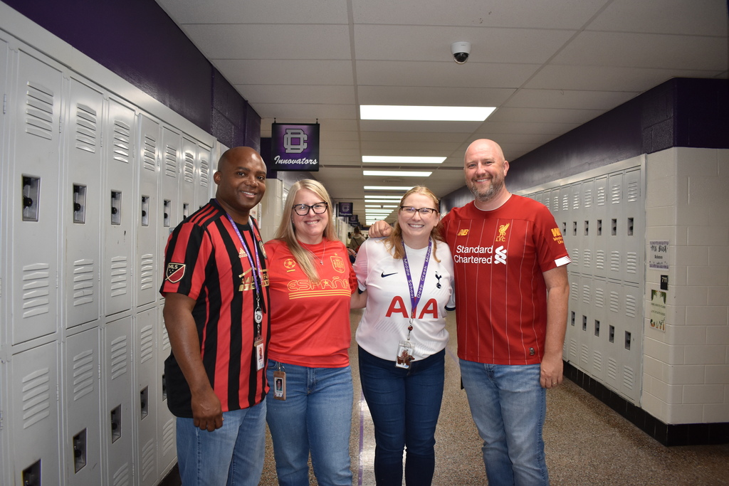 Teachers and students posing for jersey Day!