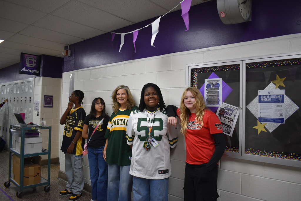 Teachers and students posing for jersey Day!