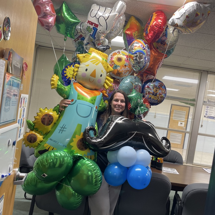 principal of the school with “anything but birthday balloons” celebrating her birthday