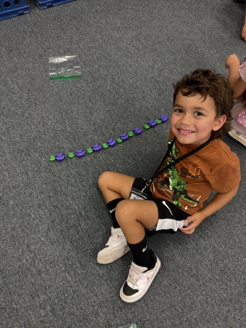 students creating patterns with manipulatives