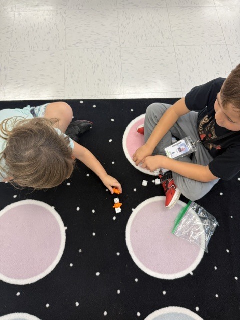 students creating patterns with manipulatives