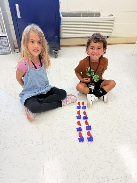 students creating patterns with manipulatives