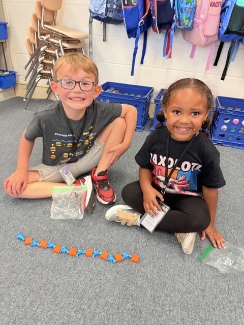 students creating patterns with manipulatives