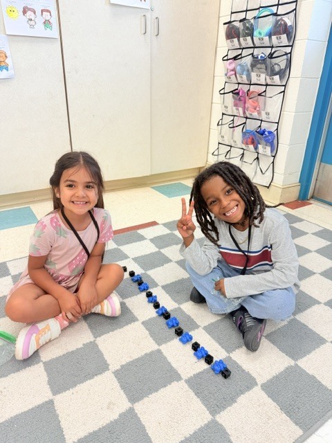 students creating patterns with manipulatives