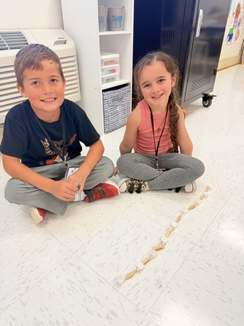 students creating patterns with manipulatives