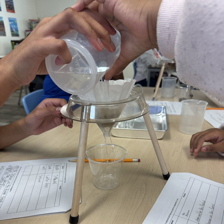 students doing a mixtures and solutions experiment
