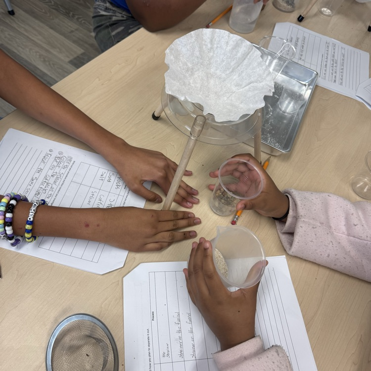 students doing a mixtures and solutions experiment