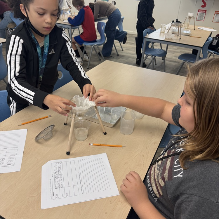students doing a mixtures and solutions experiment