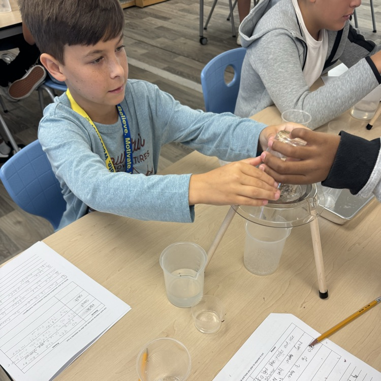students doing a mixtures and solutions experiment