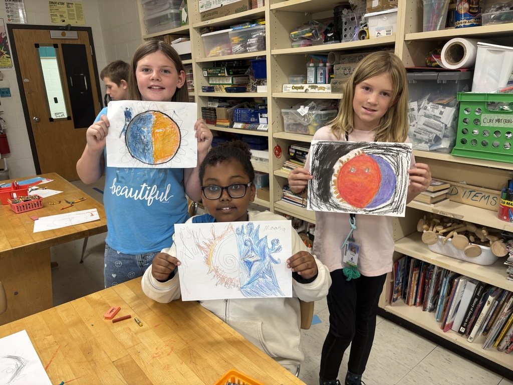 A 5th grade student works on a detailed Sun and Moon design in preparation for creating a clay sculpture.