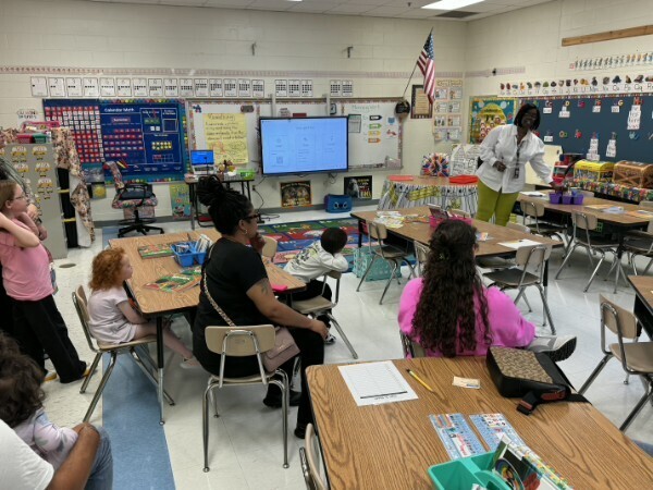 Mrs. Christmas delivering her Open House presentation to students and their families