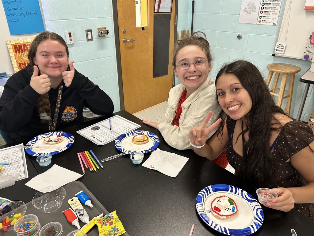 students smiling with the cookie cell creations