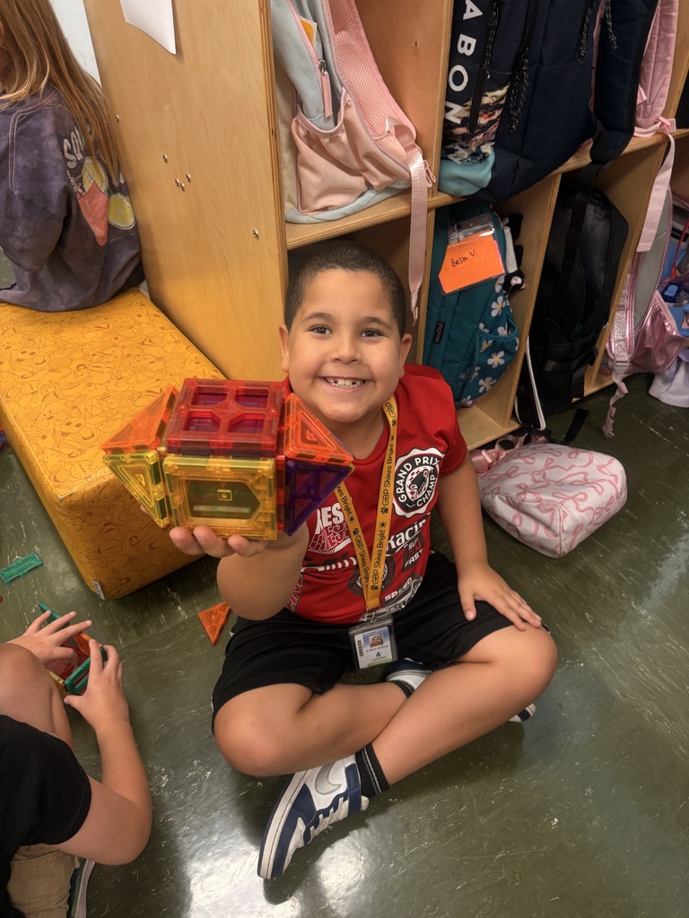 A student showing off his magnatile masterpiece.