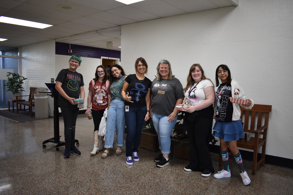 Teachers and students dressed in their band outfits