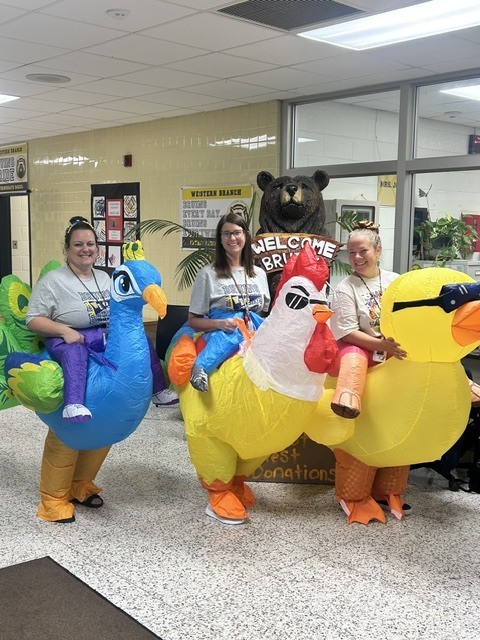 Teachers in bird costumes