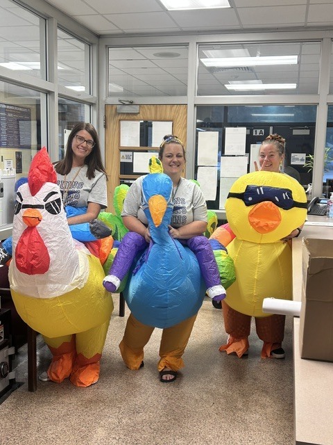 Teachers in bird costumes
