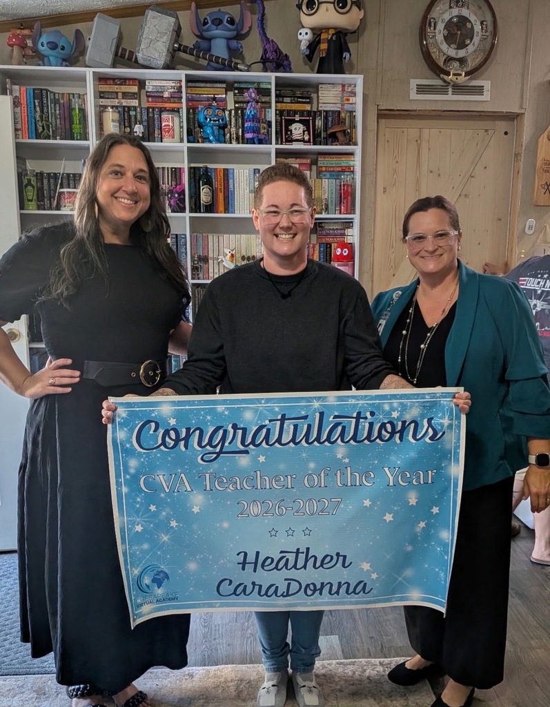 3 women holding a congratulations sign 