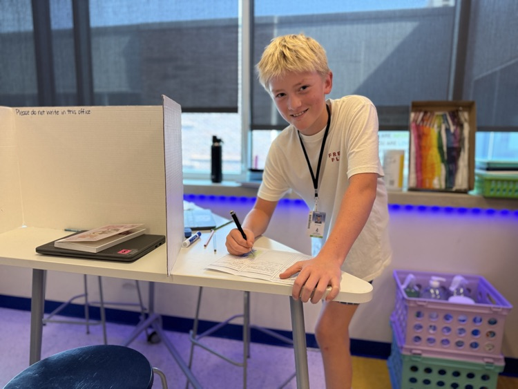 a student smiling working on a Friday!
