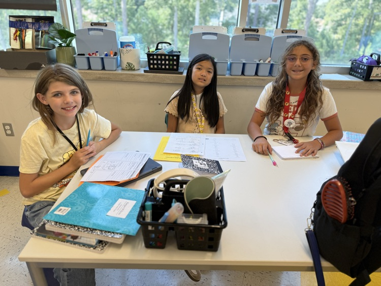 student smiling working in a group