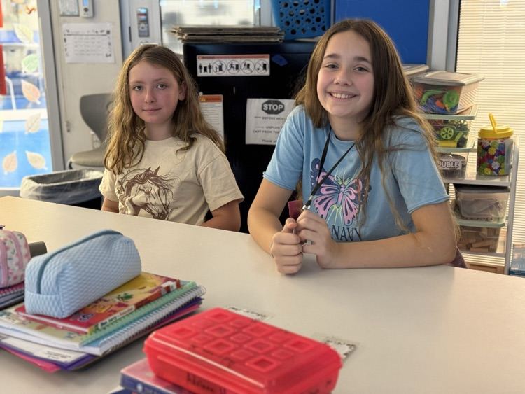 student smiling working in a group