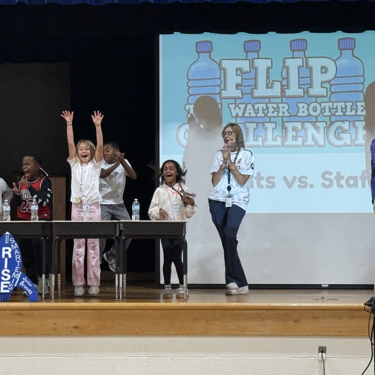 student jumping for joy over beating the teachers for the Flip the water bottle challenge.