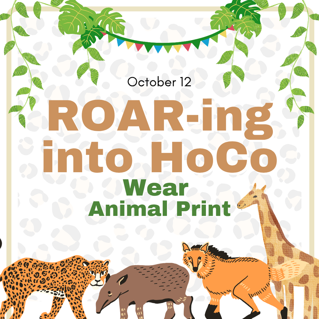 A festive graphic announcing the October 12 spirit day with the text, Roar-ing into HoCo, and Wear Animal Print. The background features a subtle leopard spot pattern framed by hanging green foliage and a colorful banner. At the bottom, illustrations of safari animals including a leopard, tapir, wolf, and giraffe gather together. The design creates an adventurous, cheerful, and energetic vibe.