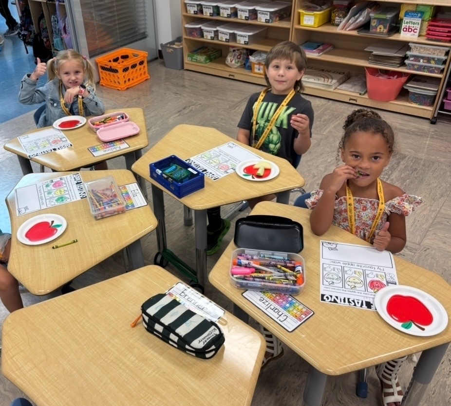 Mrs. Tummons' students using what they have learned about taste to taste apples.