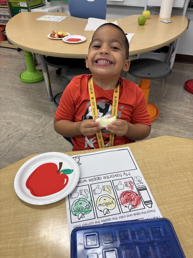 One of Mrs. Tummons' students tasting apples