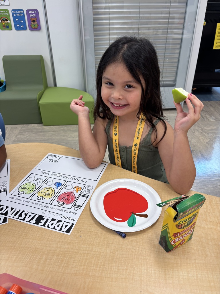 One of Mrs. Tummons' kindergarteners tasting apples