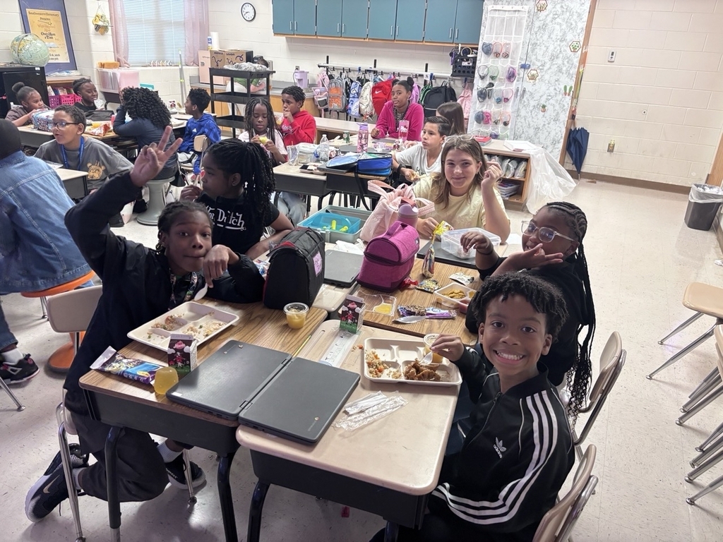 students eating lunch in the classroom