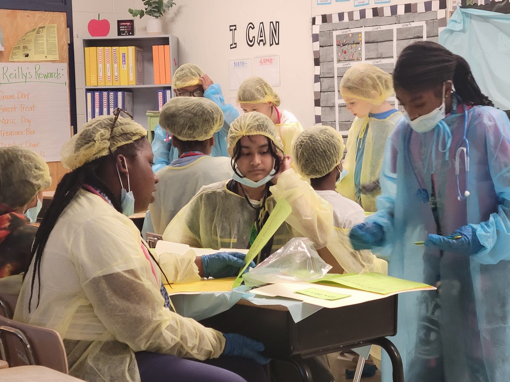 Students in scrubs doing order of operations