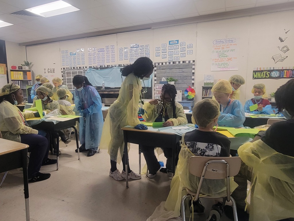 Students in scrubs doing order of operations