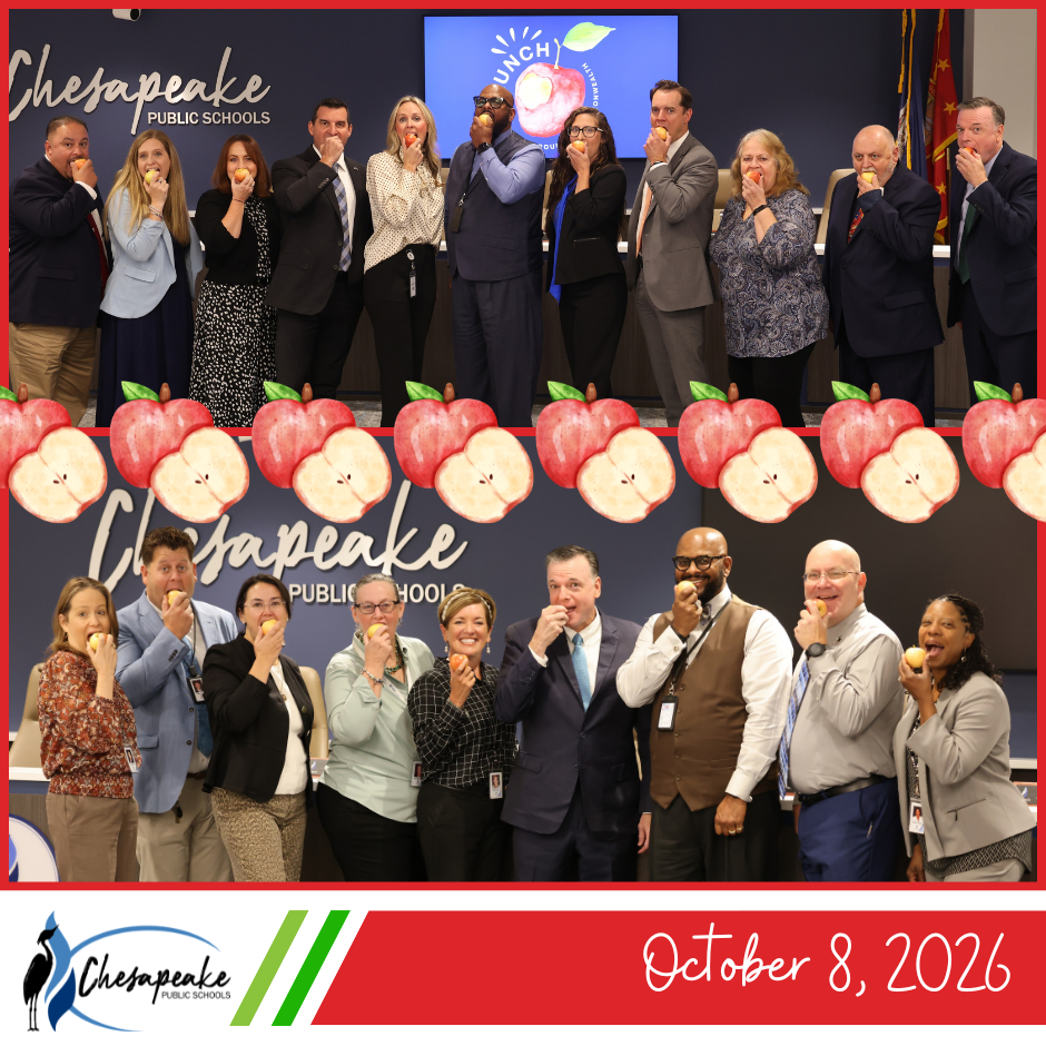 Image of board members and Cabinet memebers biting into an apple happily