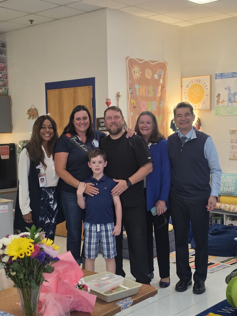Mrs. Yohe, her family, and the GTP administration team pose after Mrs. Yohe is named teacher of the year