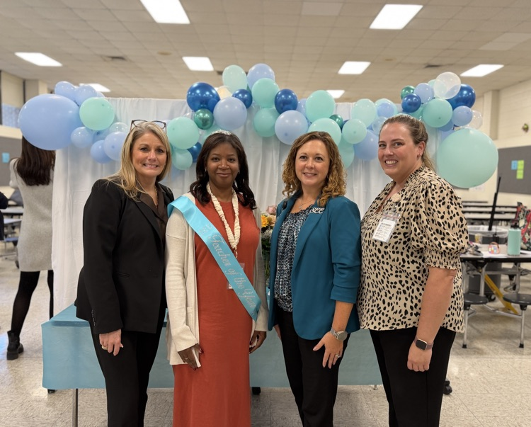 Mrs. Mosier, Mrs. Toppin, Dr. Cioppa, and Ms. Adams celebrating Mrs. Toppin