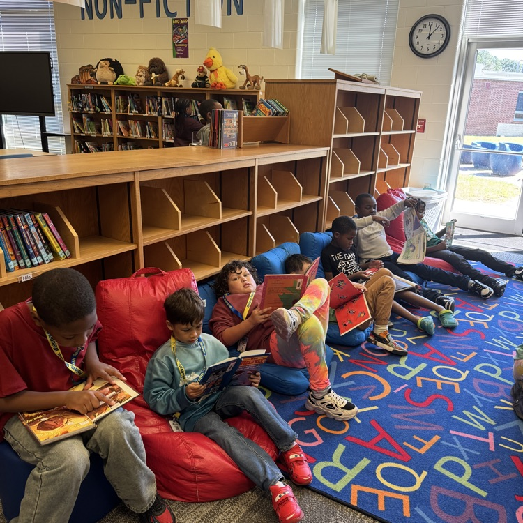 students reading in the library