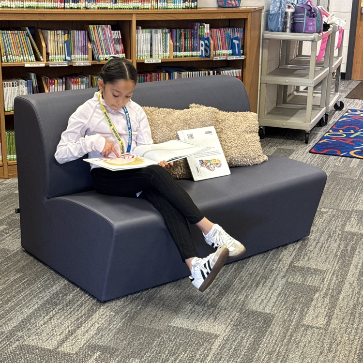 students reading in the library