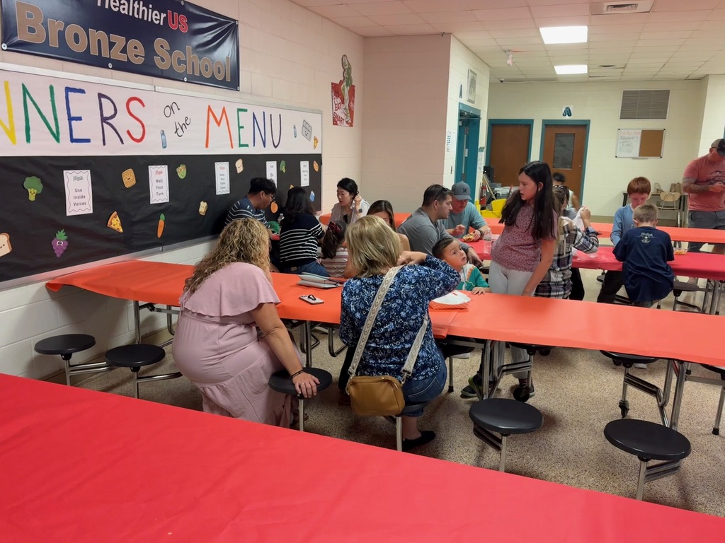 families eating dinner in the cafeteria 
