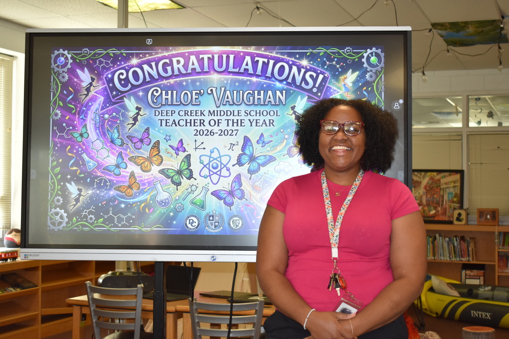 Mrs. Vaughan in front of her teacher of the year sign!