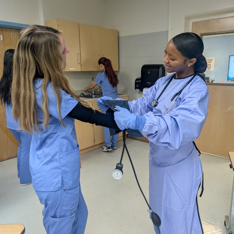 patient care tech students practicing skills