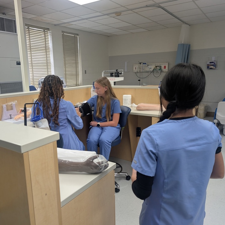 patient care tech students practicing skills