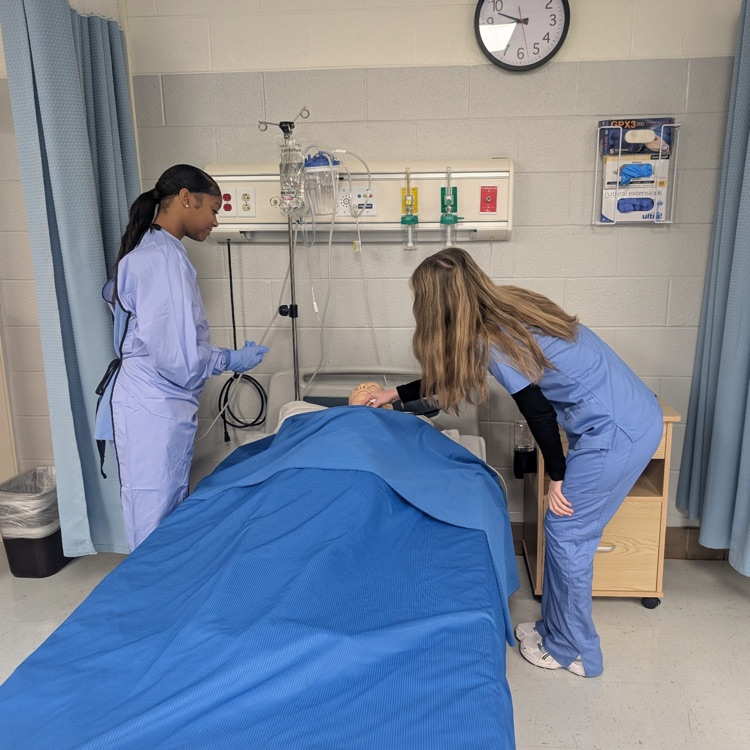 patient care tech students practicing skills